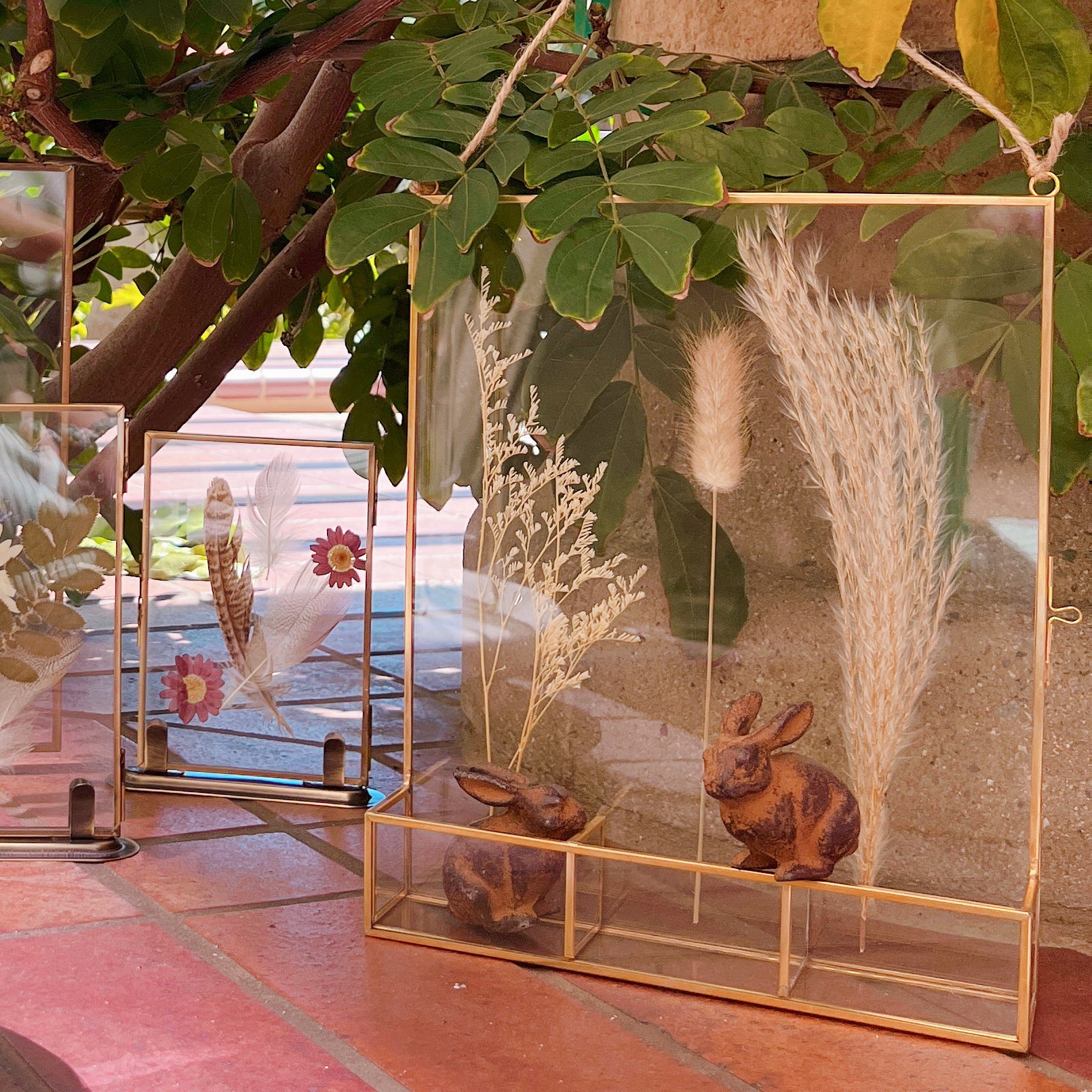 Gold-Edged Glass Frame Display with Compartment Cases